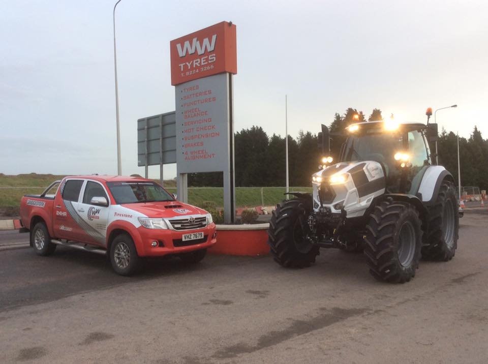 WW Tyres sign with pick up truck and tractor